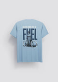 Camiseta azul celeste Never Runs Out of Fuel — vista trasera con serigrafía mujer en bicicleta y texto FUEL en azul marino, Crystal Peppers